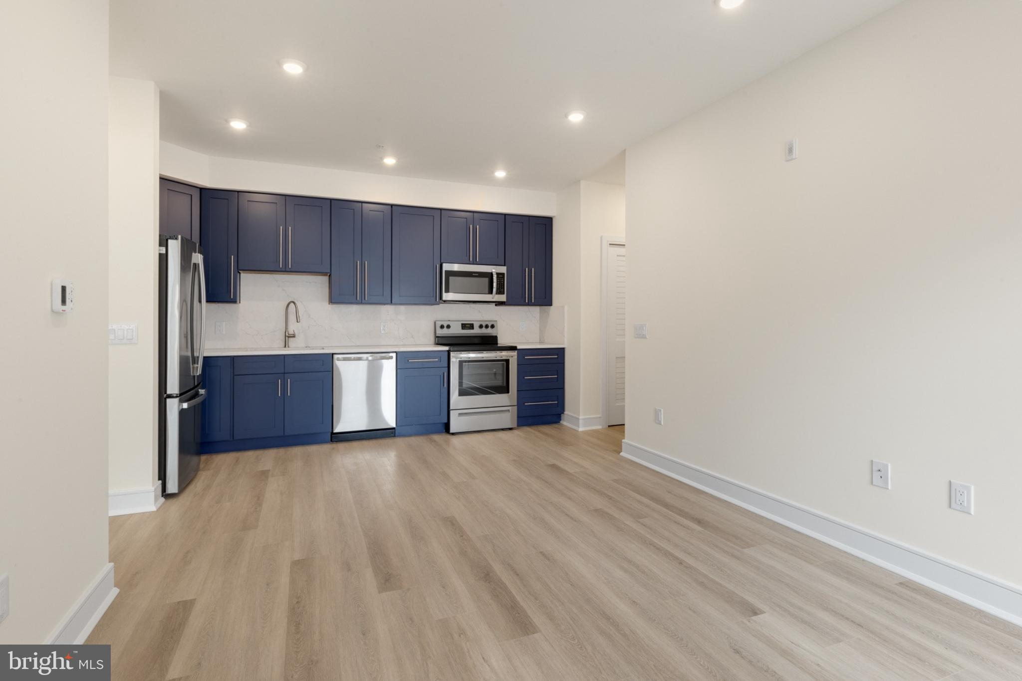 a view of kitchen with wooden floor