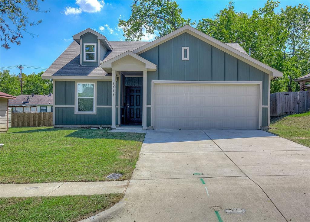 front view of a house with a yard