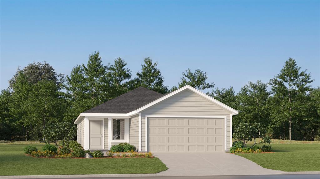 a front view of a house with a yard and trees