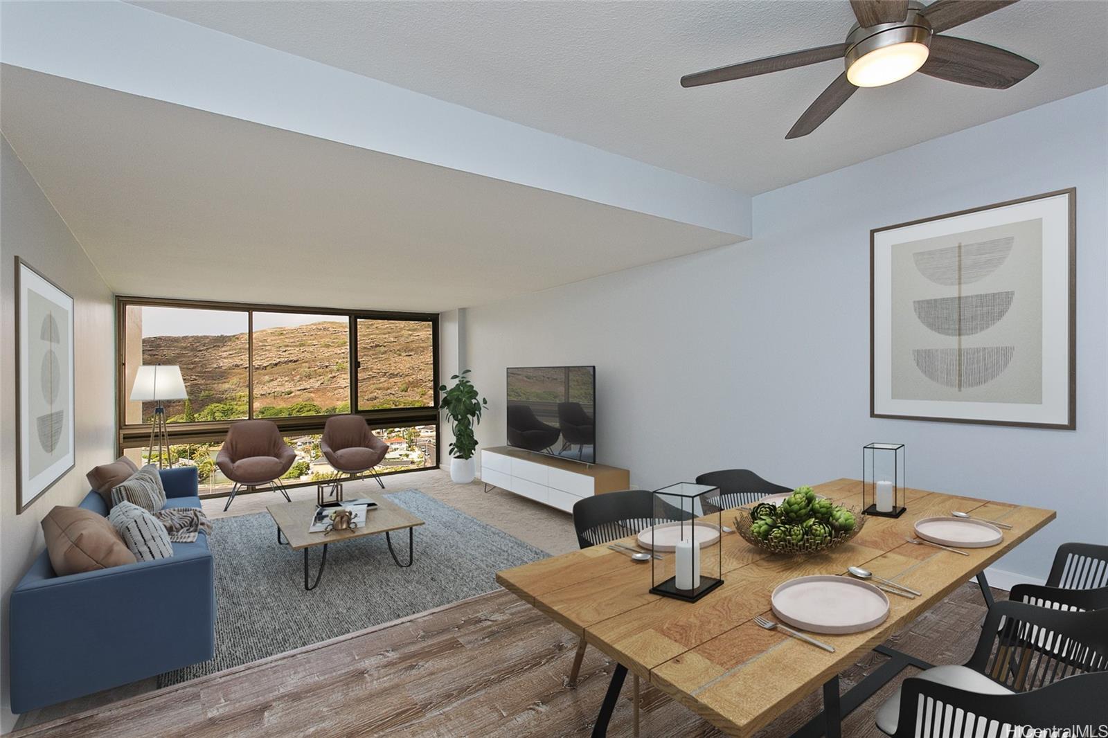 a living room with furniture and a large window