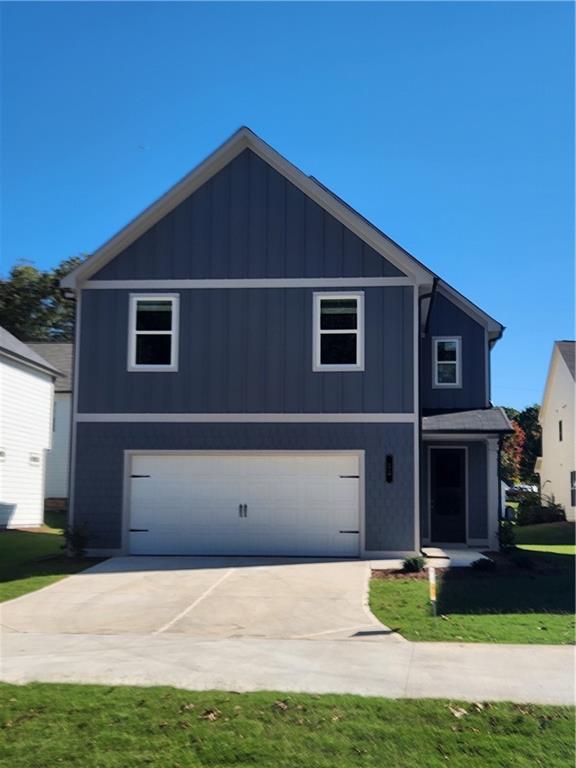 a front view of a house with yard