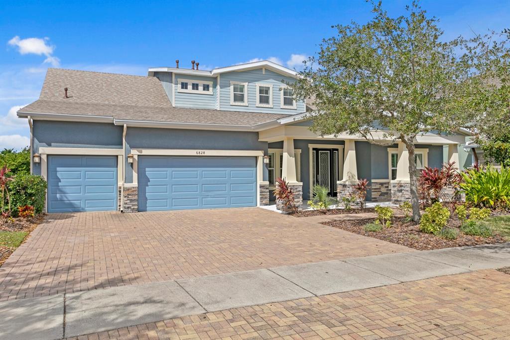 a front view of a house with yard and hallway