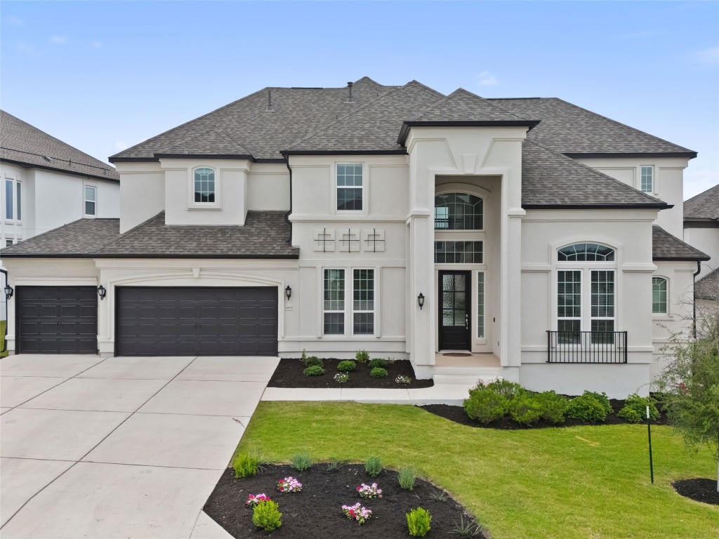 a front view of a house with a yard