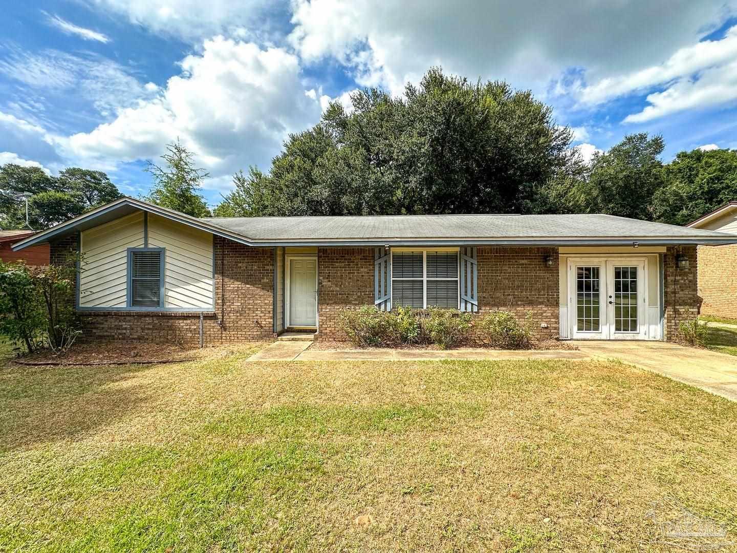 front view of a house with a yard