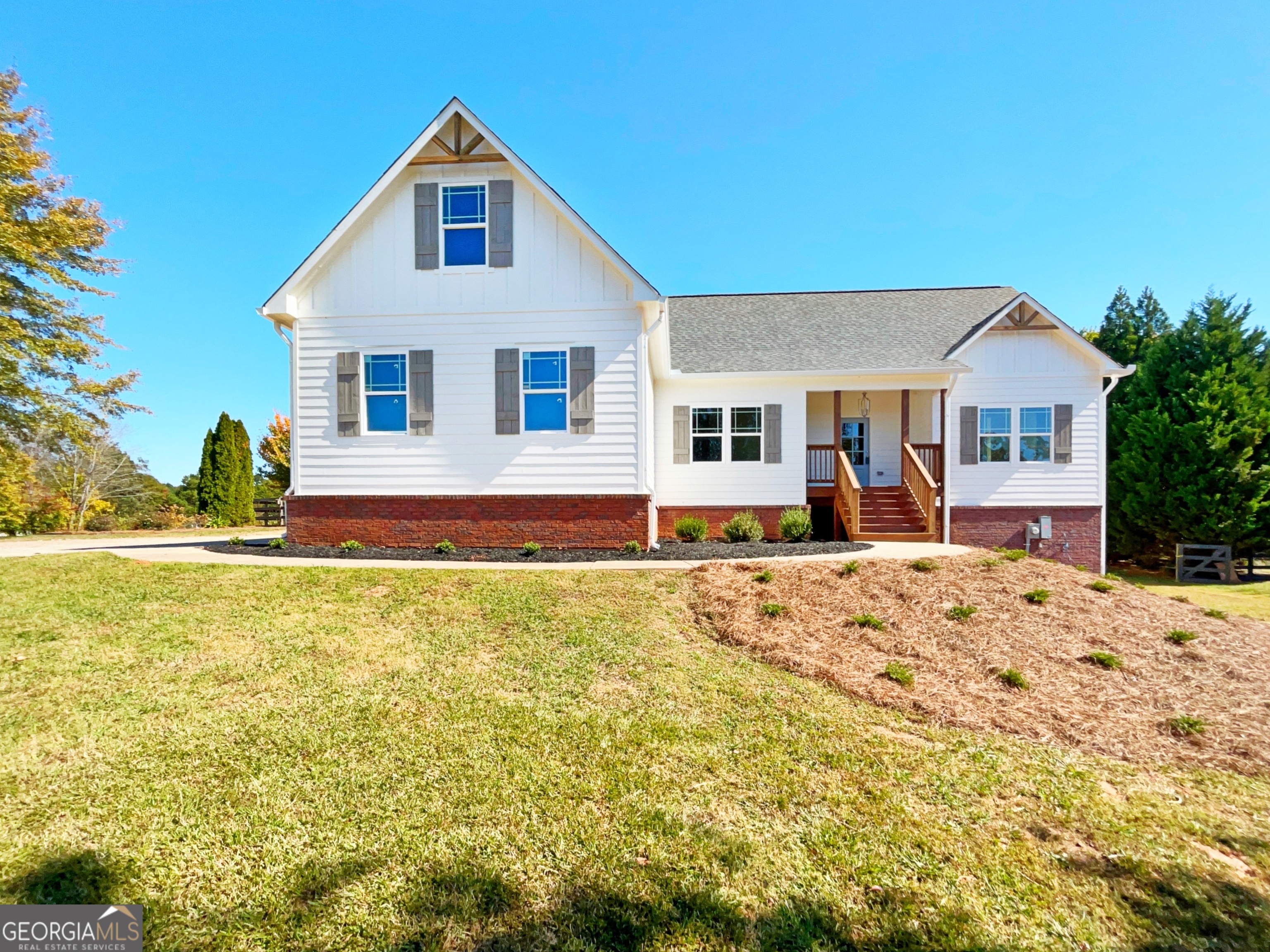 a front view of a house with a yard