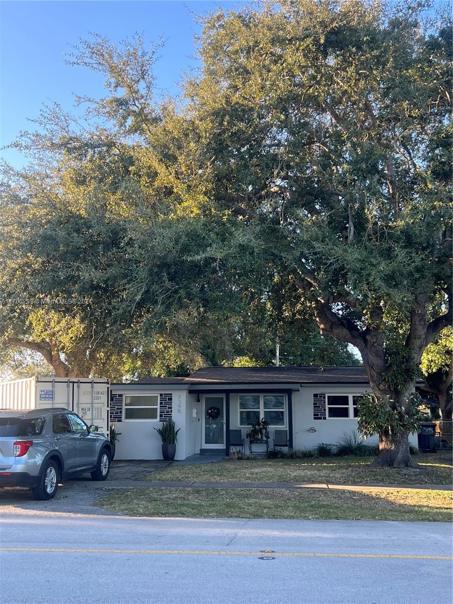 front view of a house with a yard