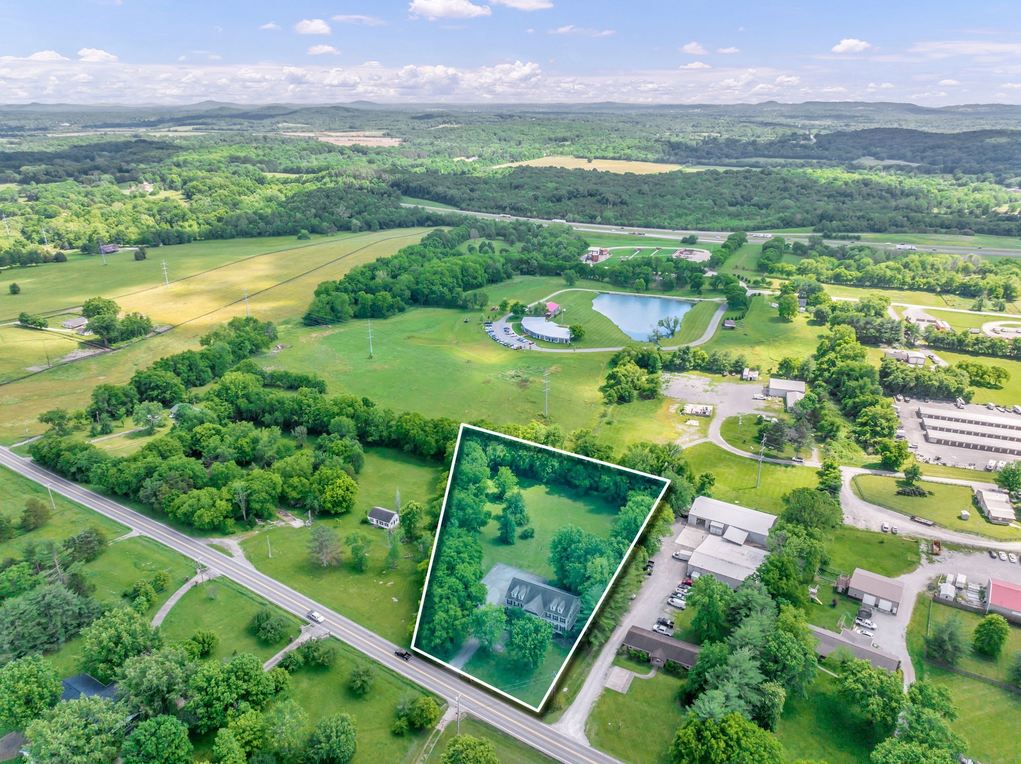 a view of a lake with a big yard