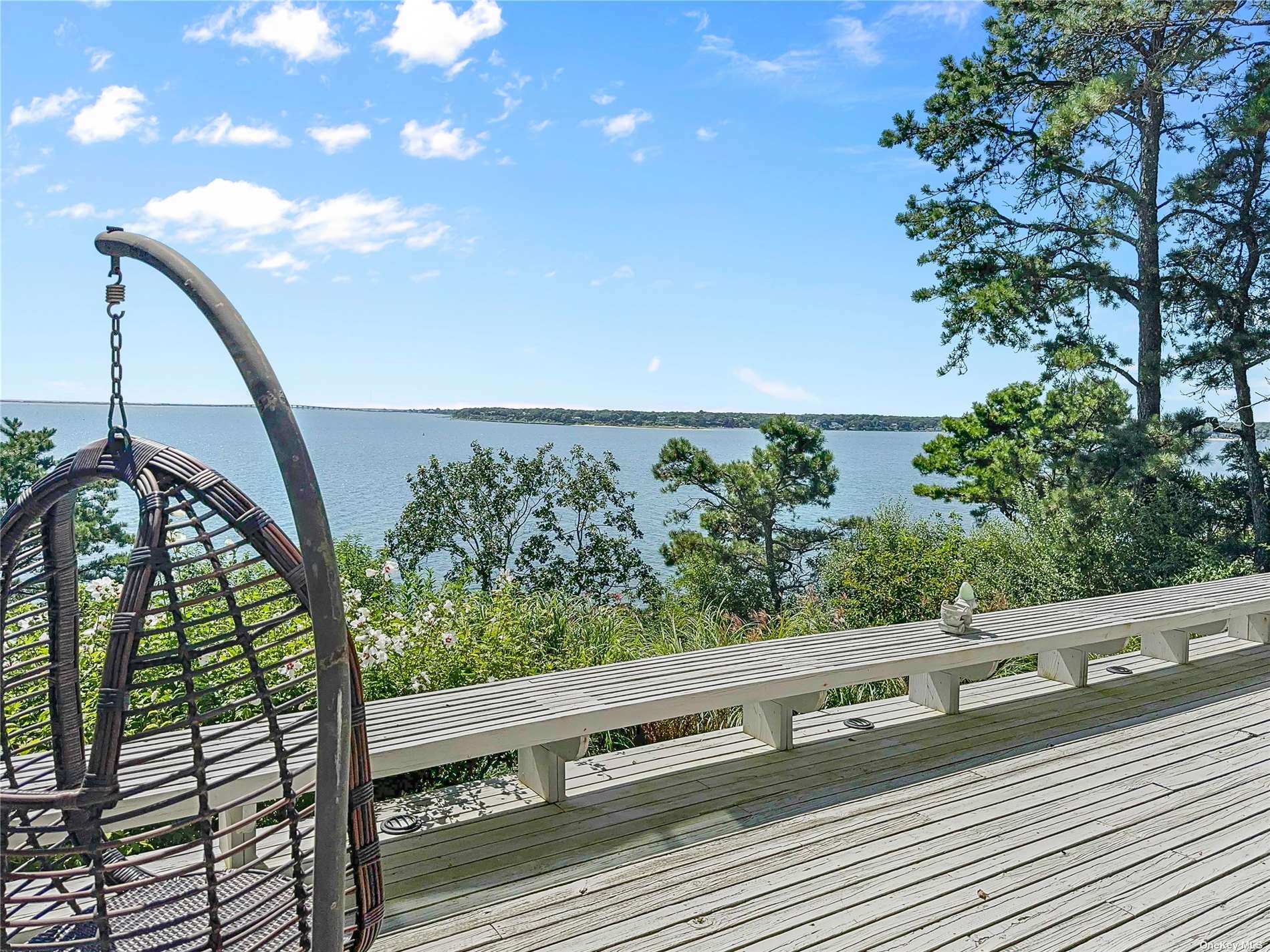 a view of balcony with lots of trees