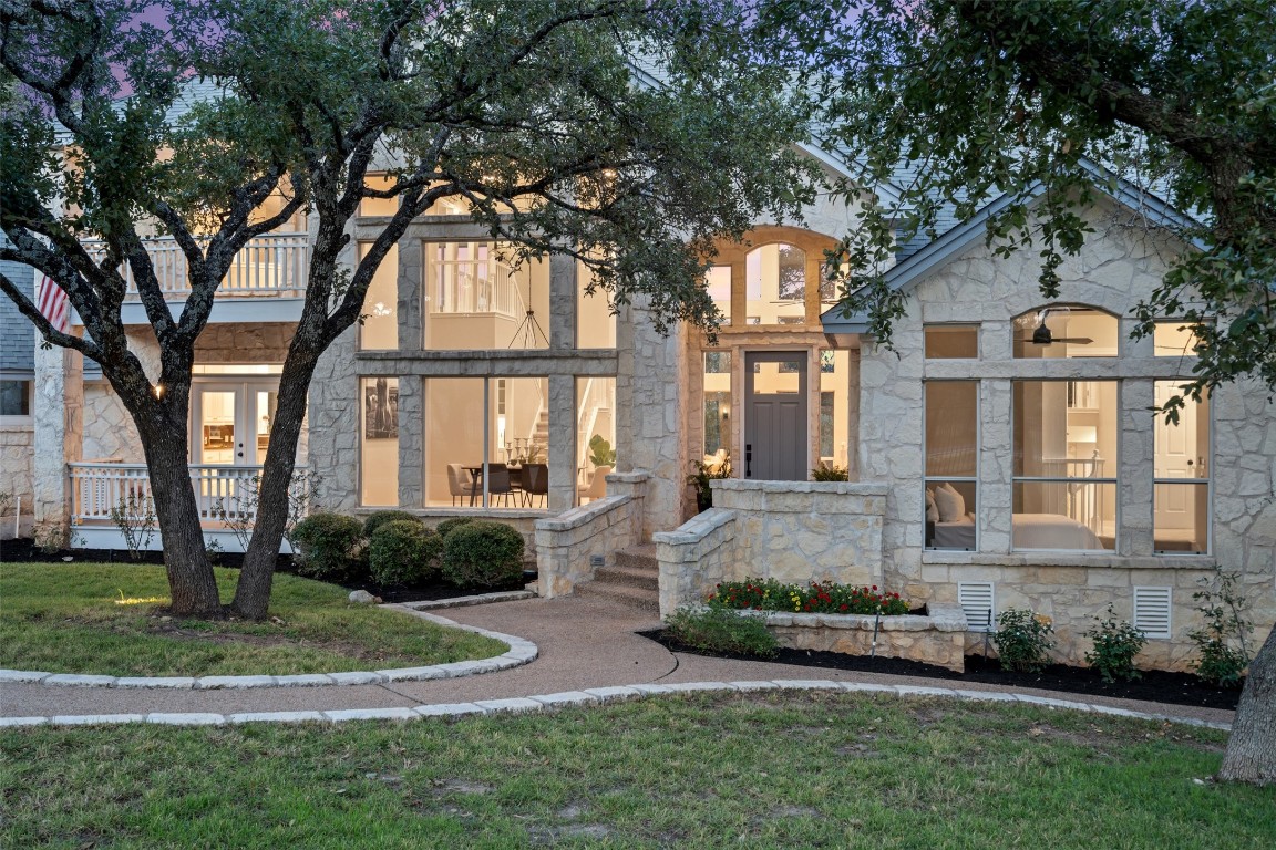 a front view of a house with a yard