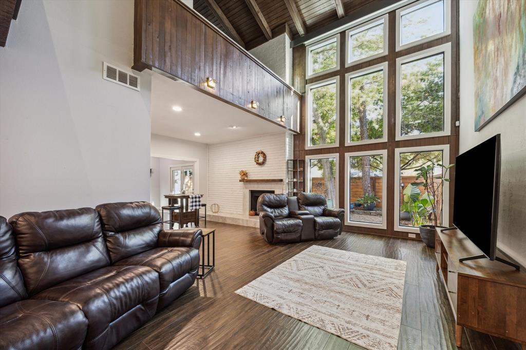 Soaring ceilings and a grand wall of windows contribute to the unique architecture of this home.