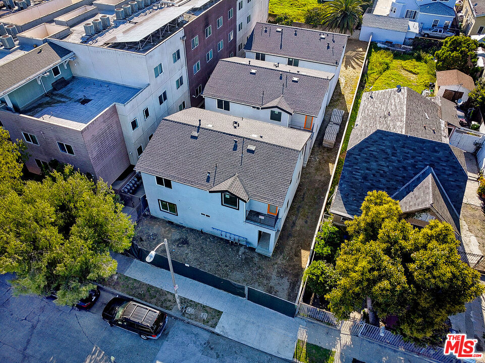 an aerial view of a house with a yard and garden