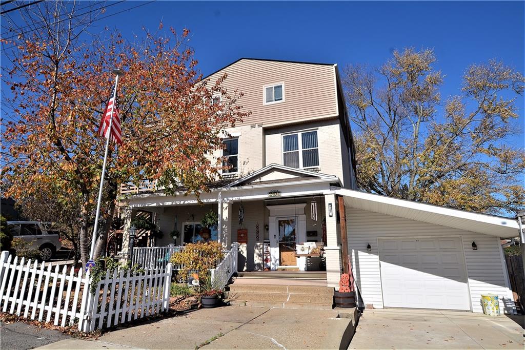 a front view of a house with parking