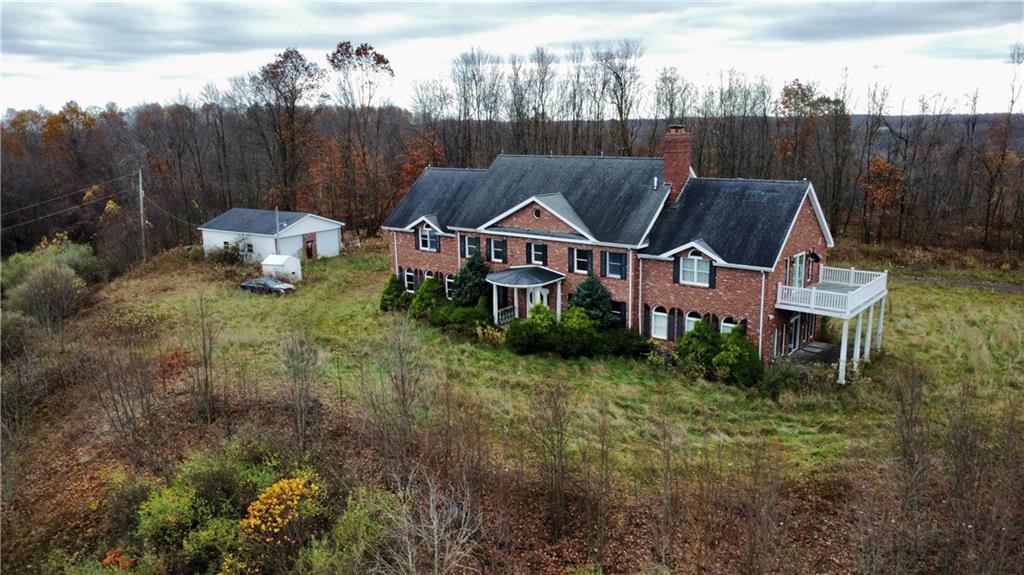 a aerial view of a house with garden