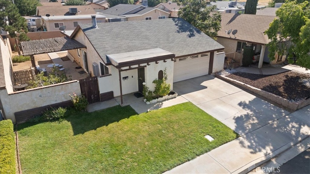 a view of a house with a backyard porch and sitting area