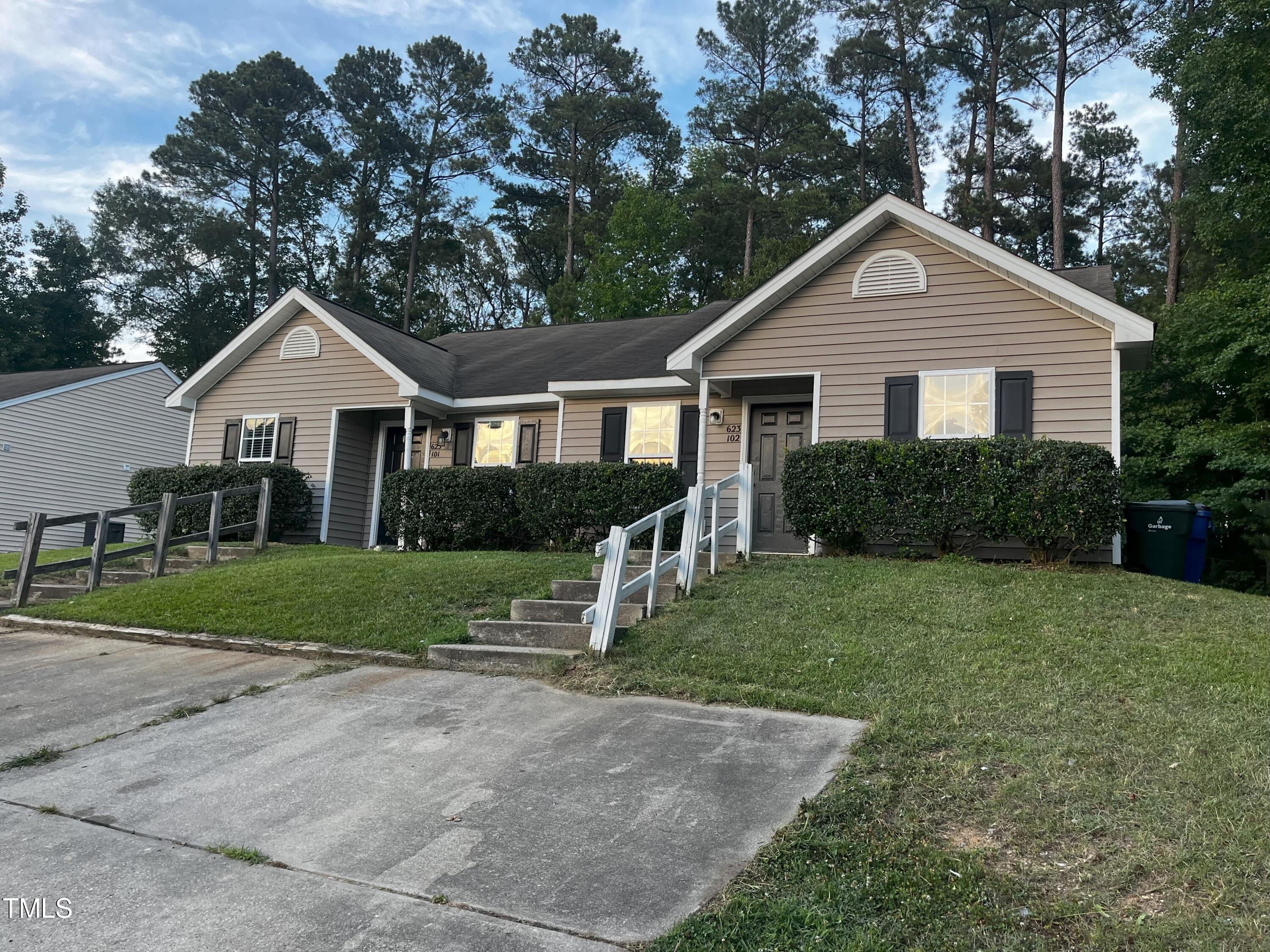 a front view of a house with yard