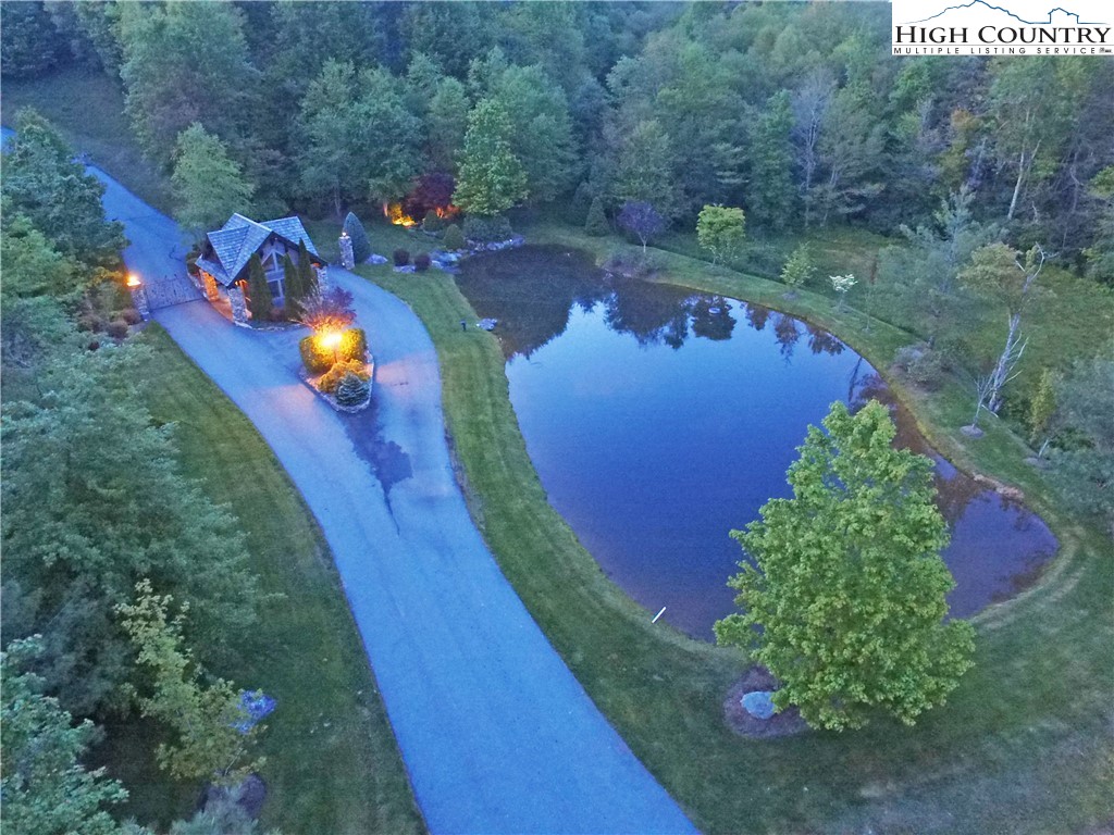 an aerial view of a house with a swimming pool