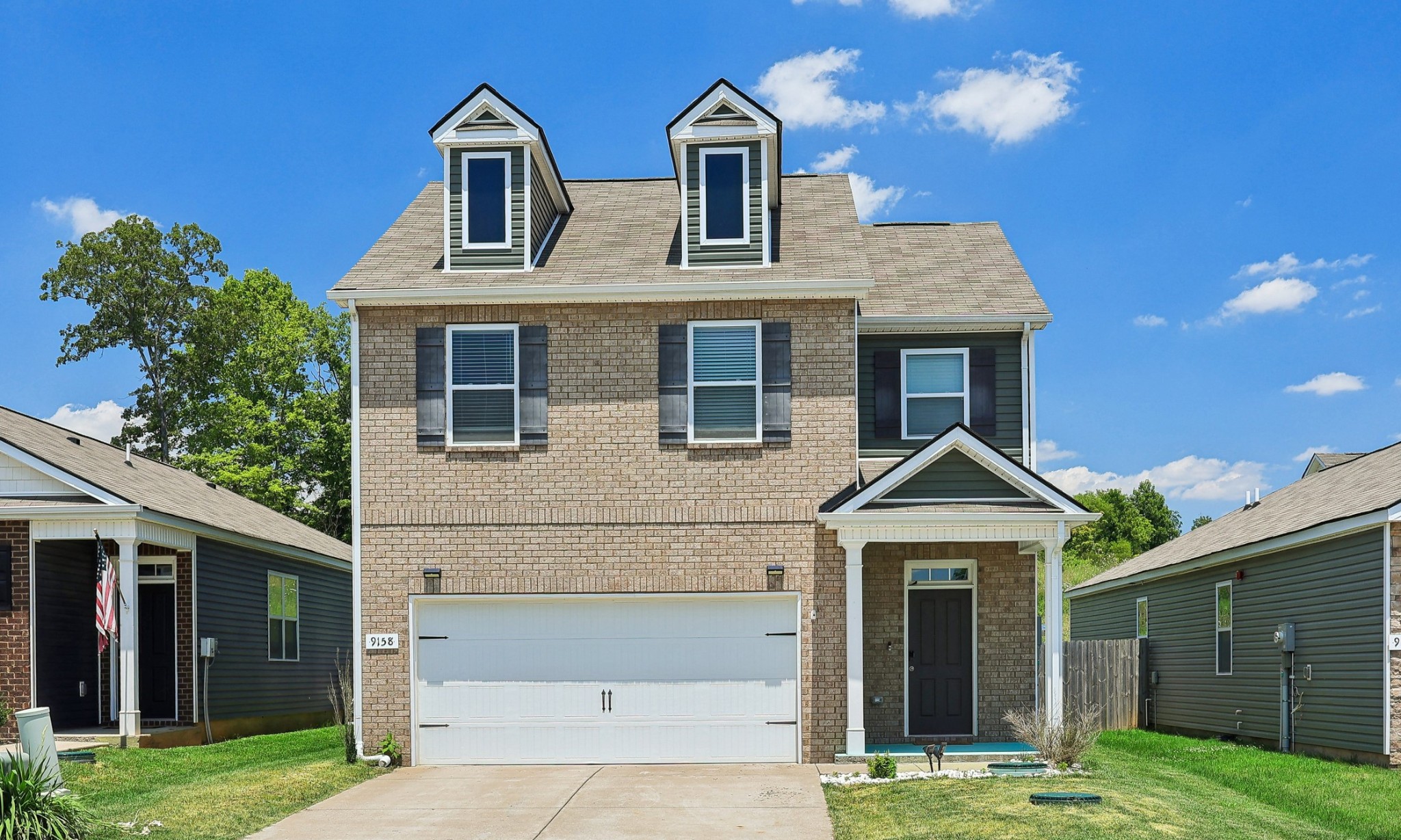 a front view of a house with yard