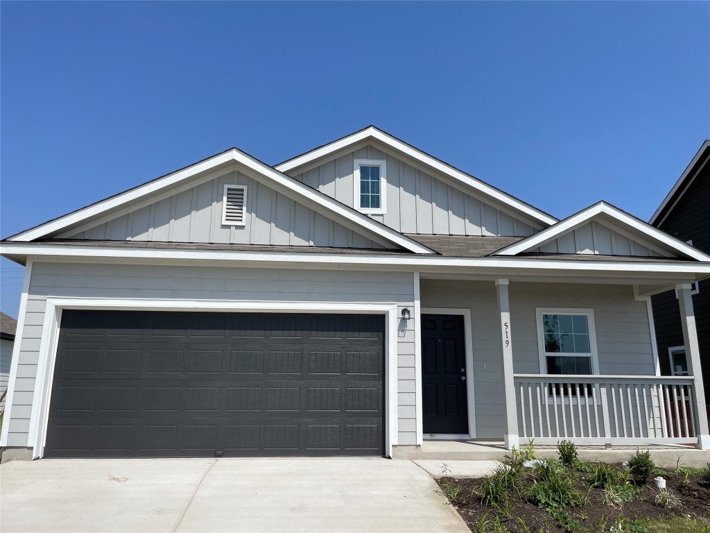 a front view of a house with garage