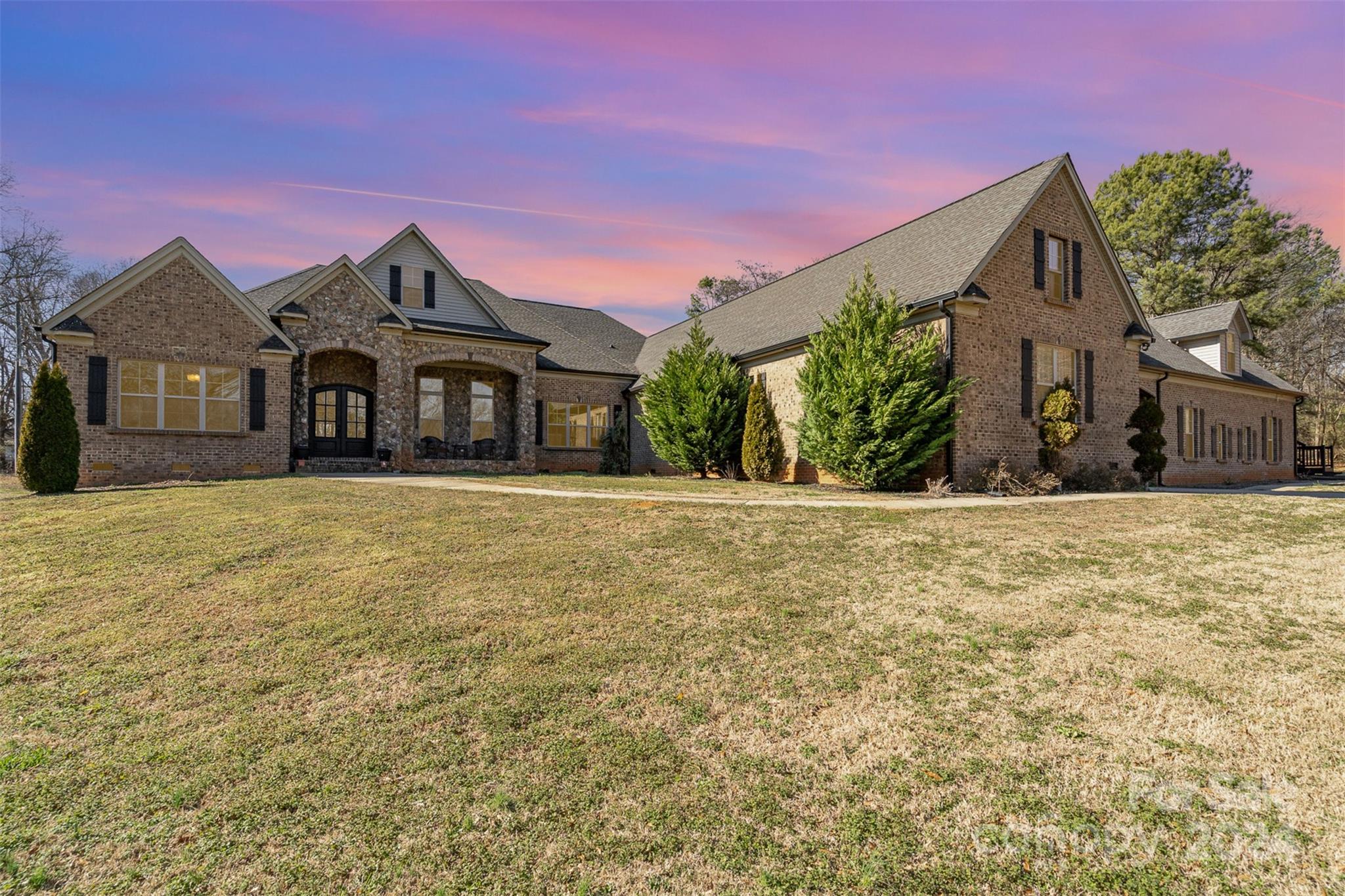 a front view of a house with a yard