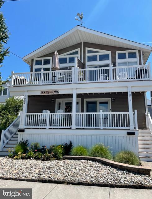 a front view of a house with a deck