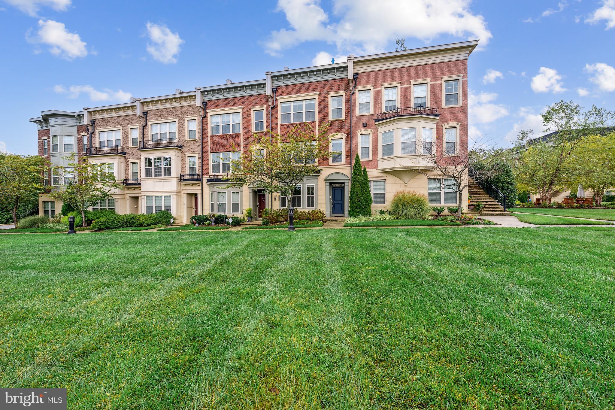 a large building with a yard in front of it