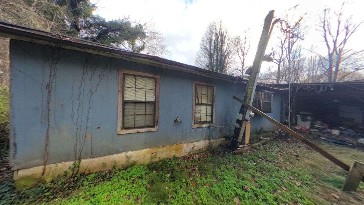 a house with trees in the background