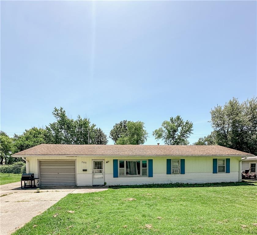 a view of house with yard and entertaining space