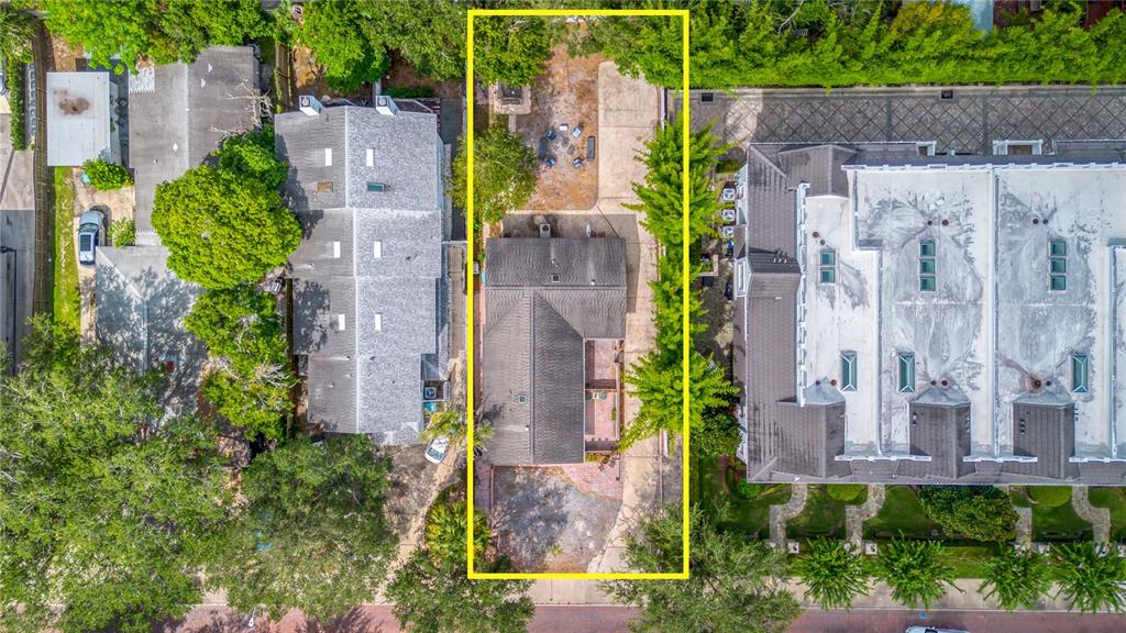 an aerial view of a house with a garden and plants