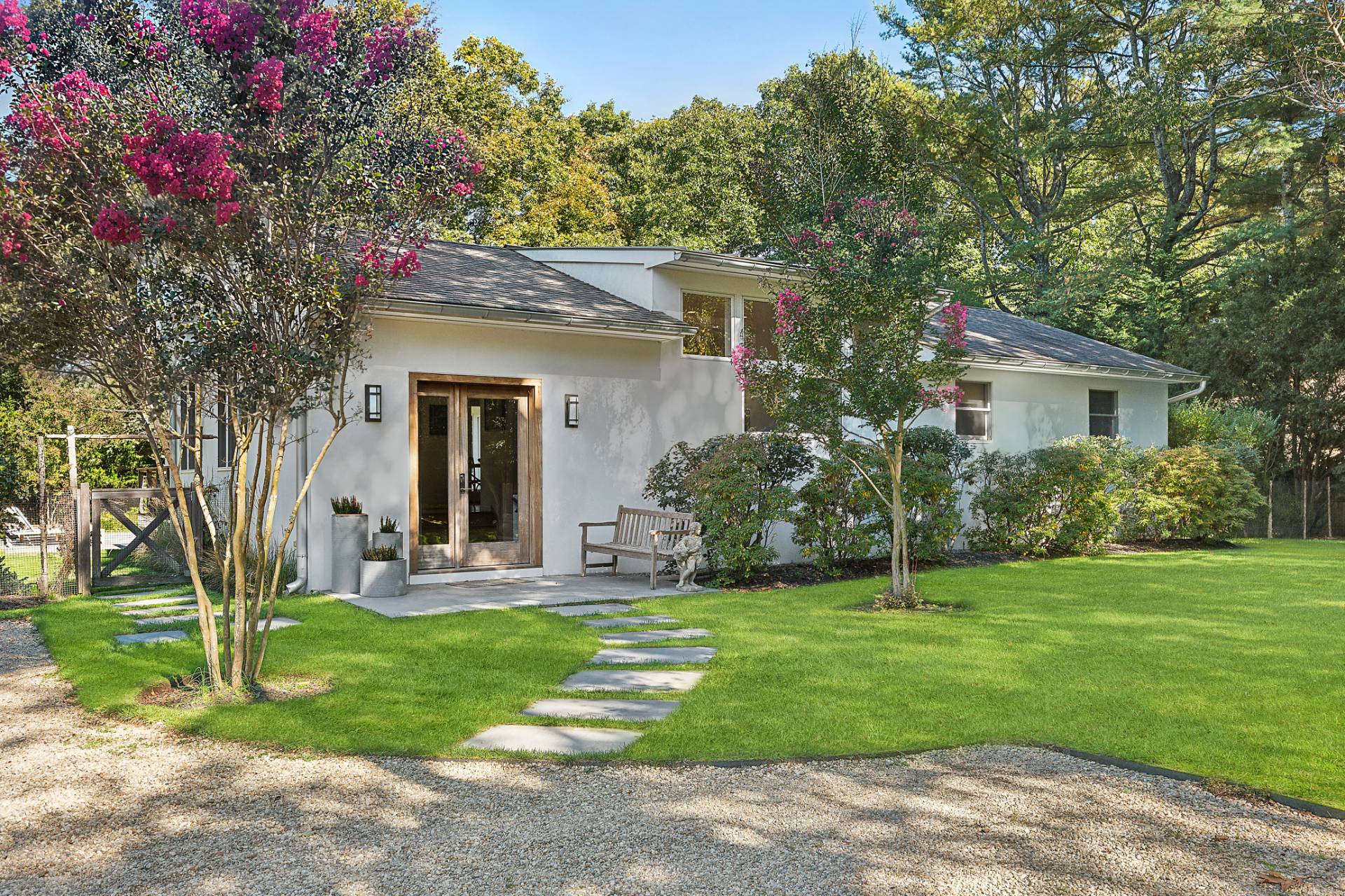 a view of a house with a yard and plants