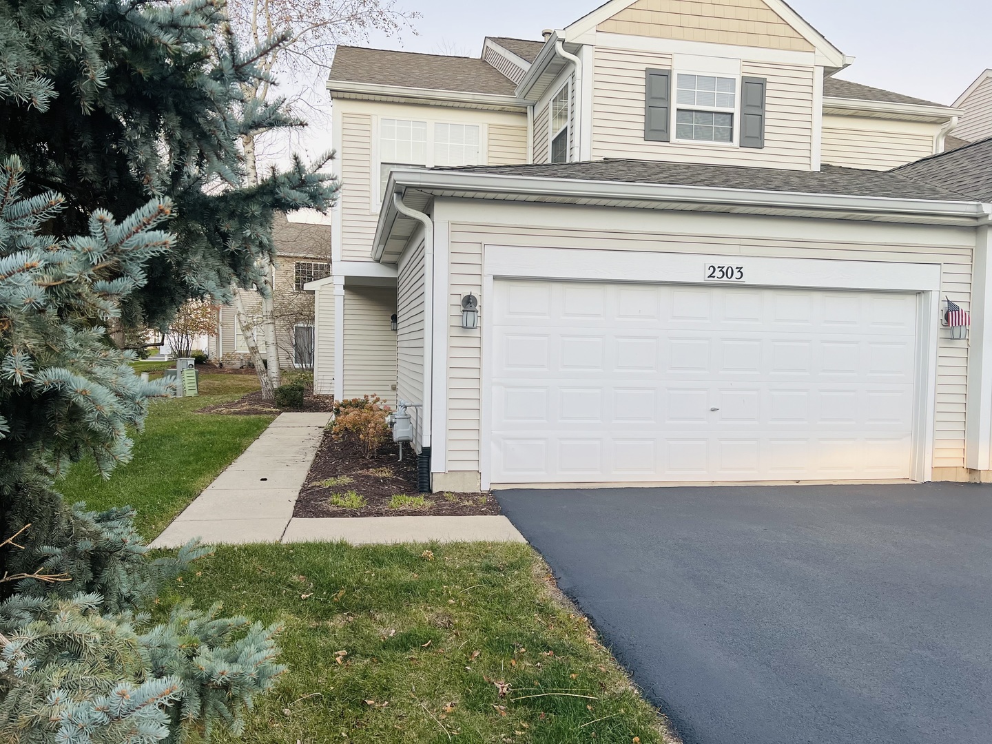 front view of a house with a yard