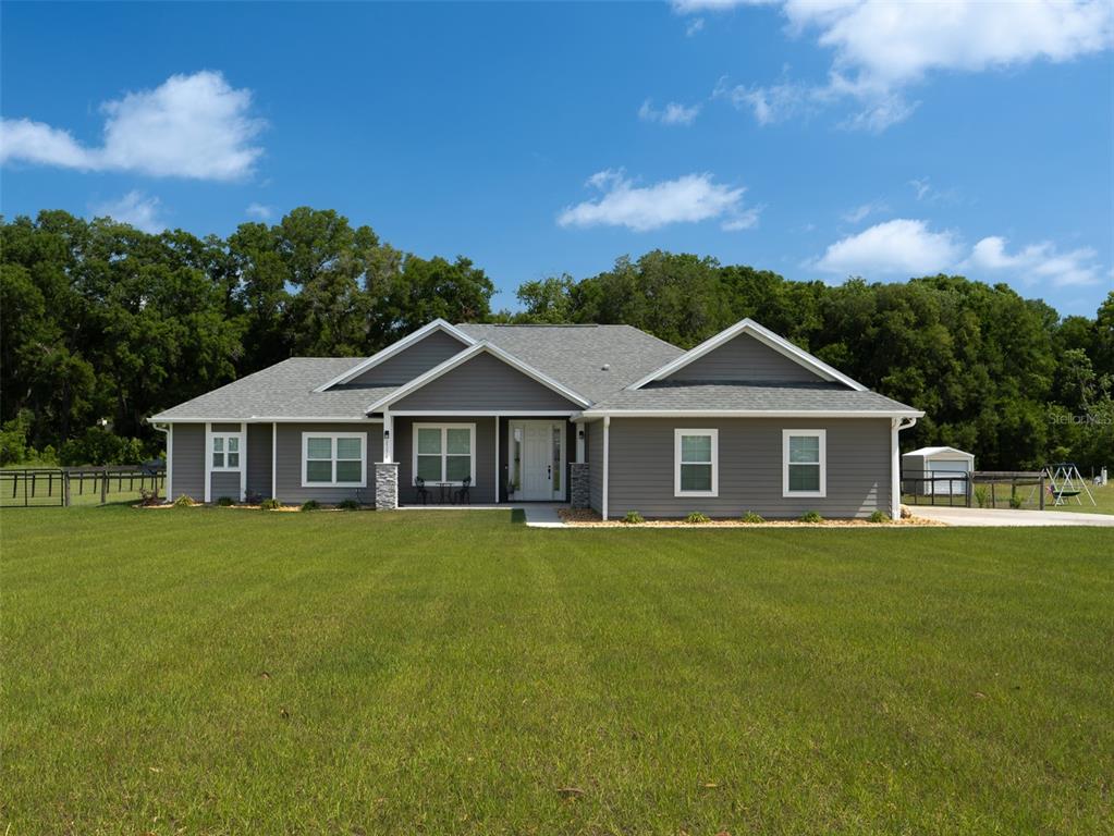 a front view of a house with yard