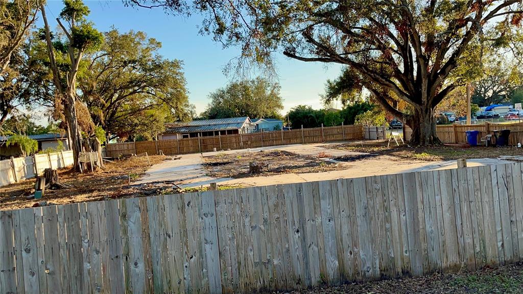 a view of outdoor space with wooden fence