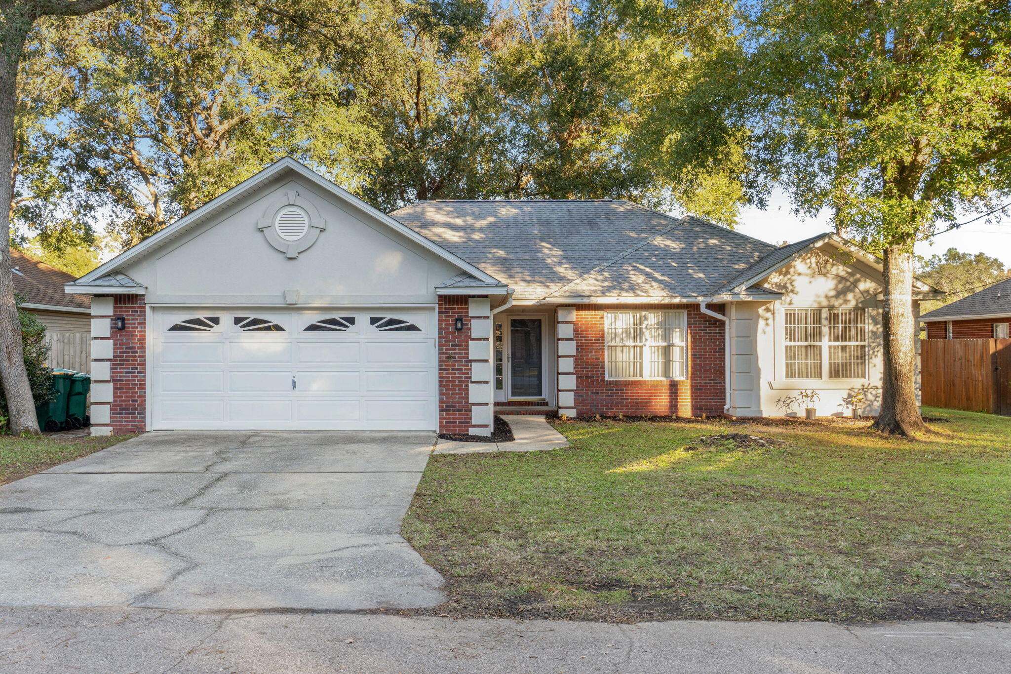 a view of a house with a yard and garage