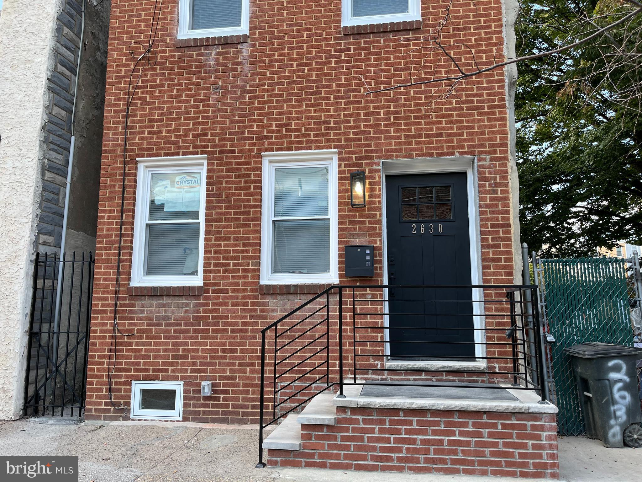 a brick building with a door and a window