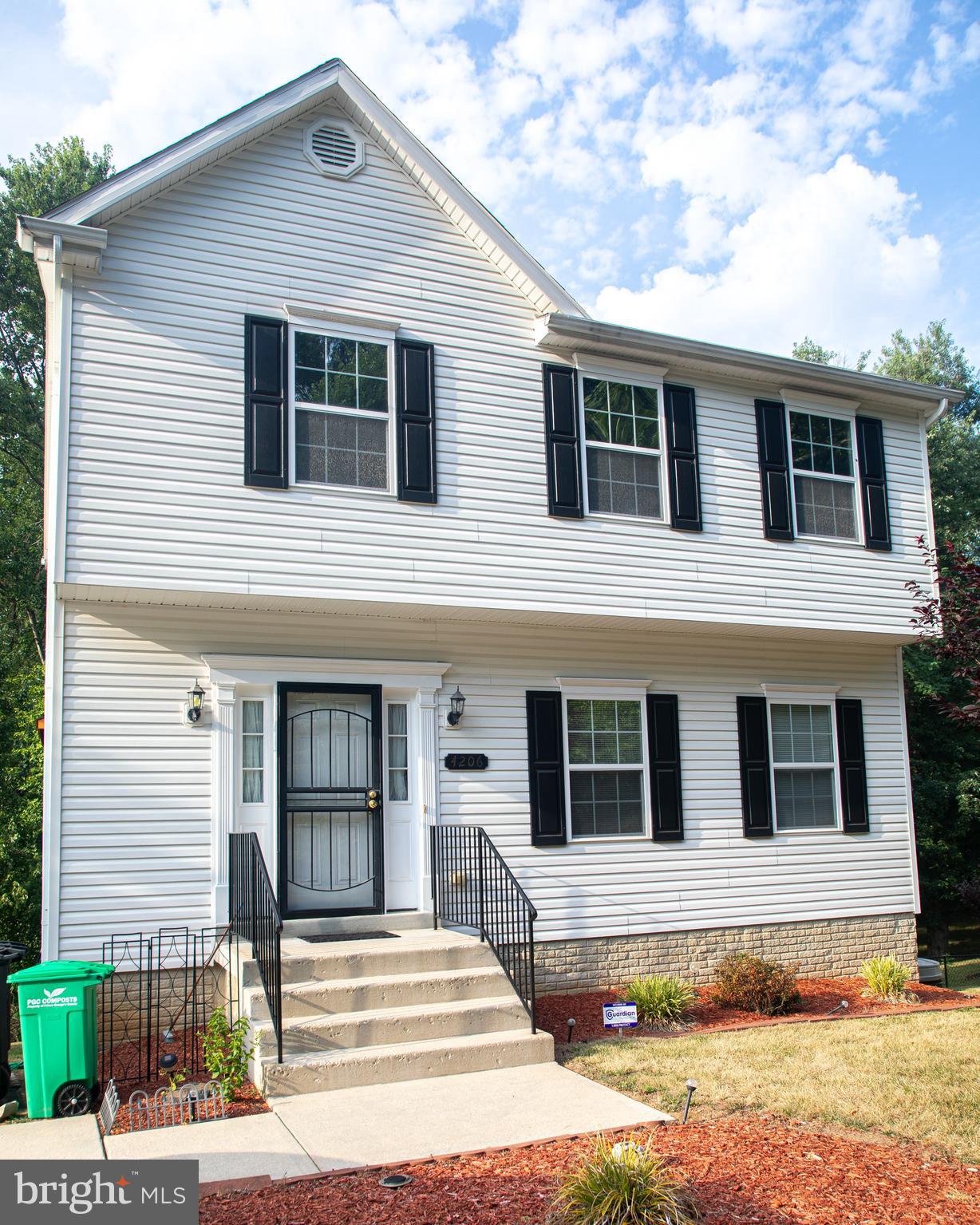 a front view of a house with a garage