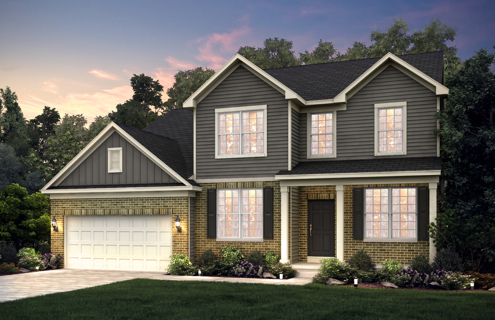 a front view of a house with a yard and garage