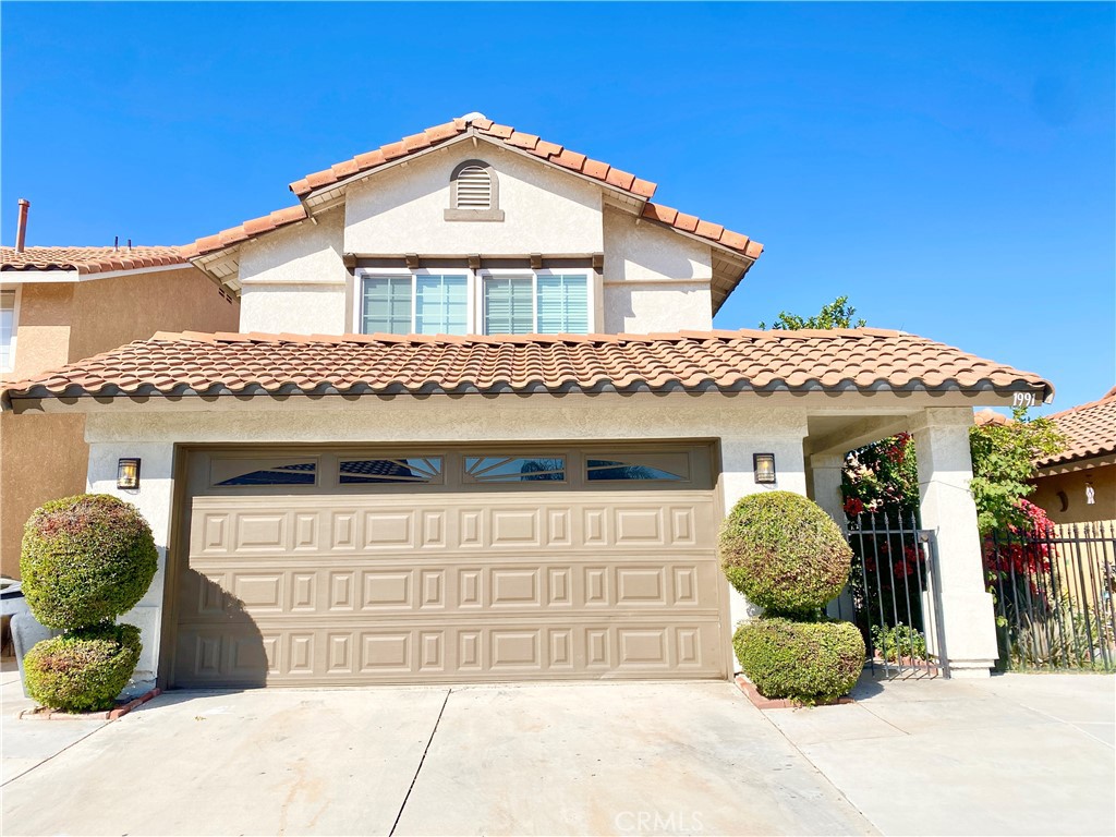 a front view of a house with a garage