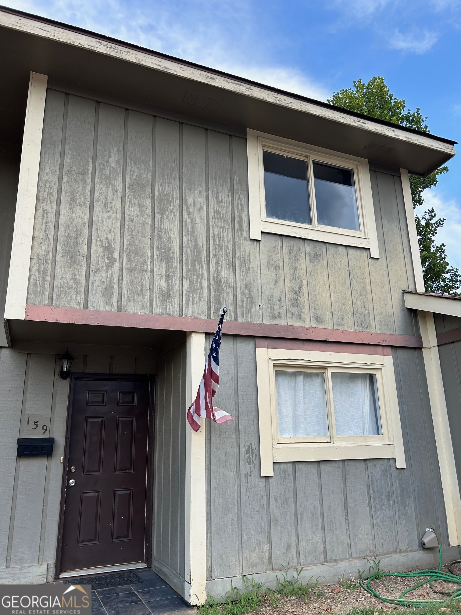 a front view of a house with a garage