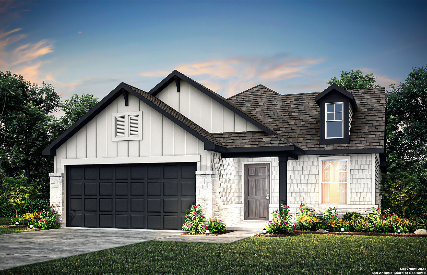 a front view of a house with a yard and garage