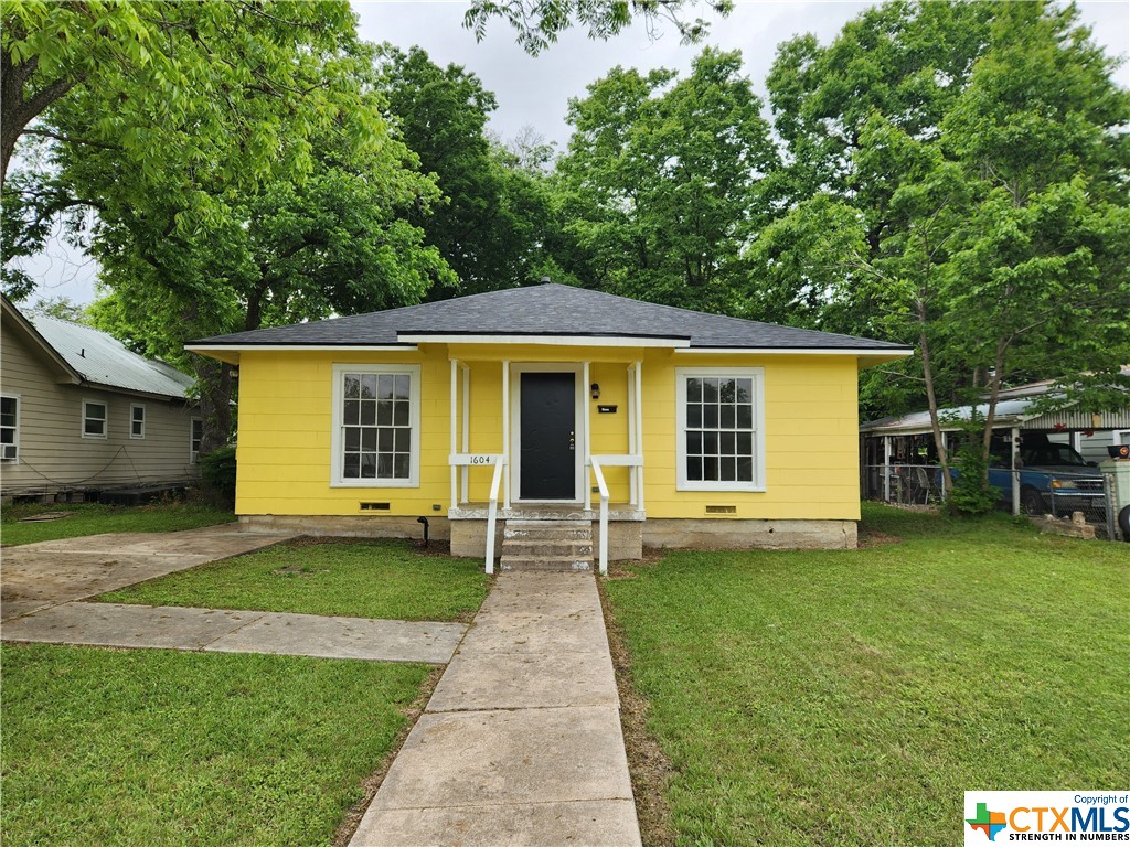 front view of a house with a yard