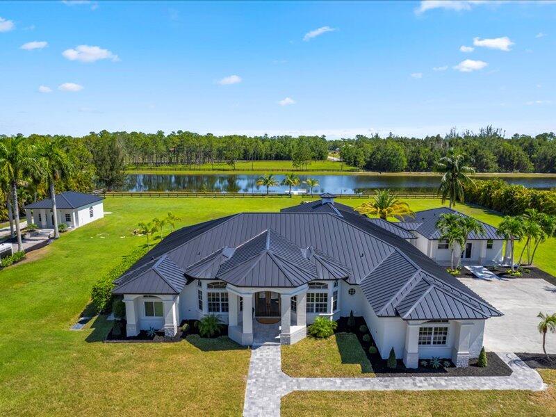 a house with swimming pool in front of it