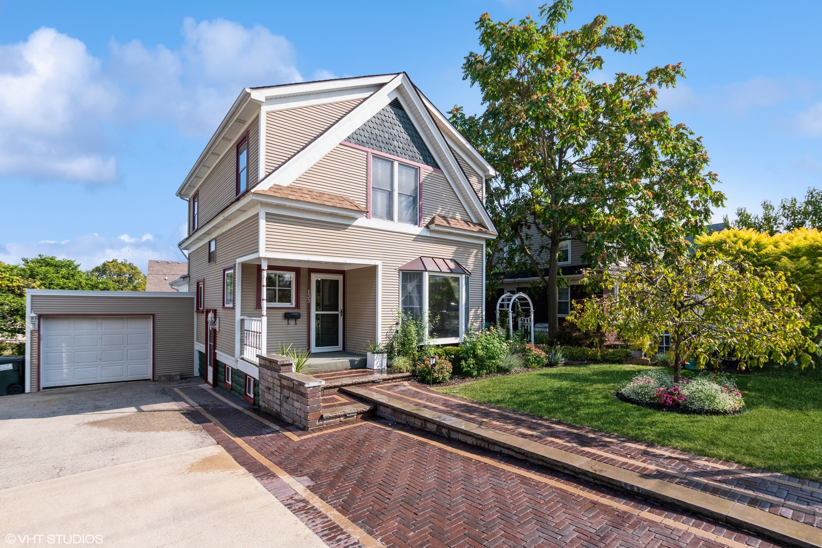 a view of a house with a yard and plants