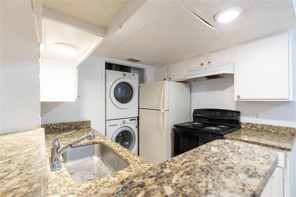 a kitchen with a stove and a sink