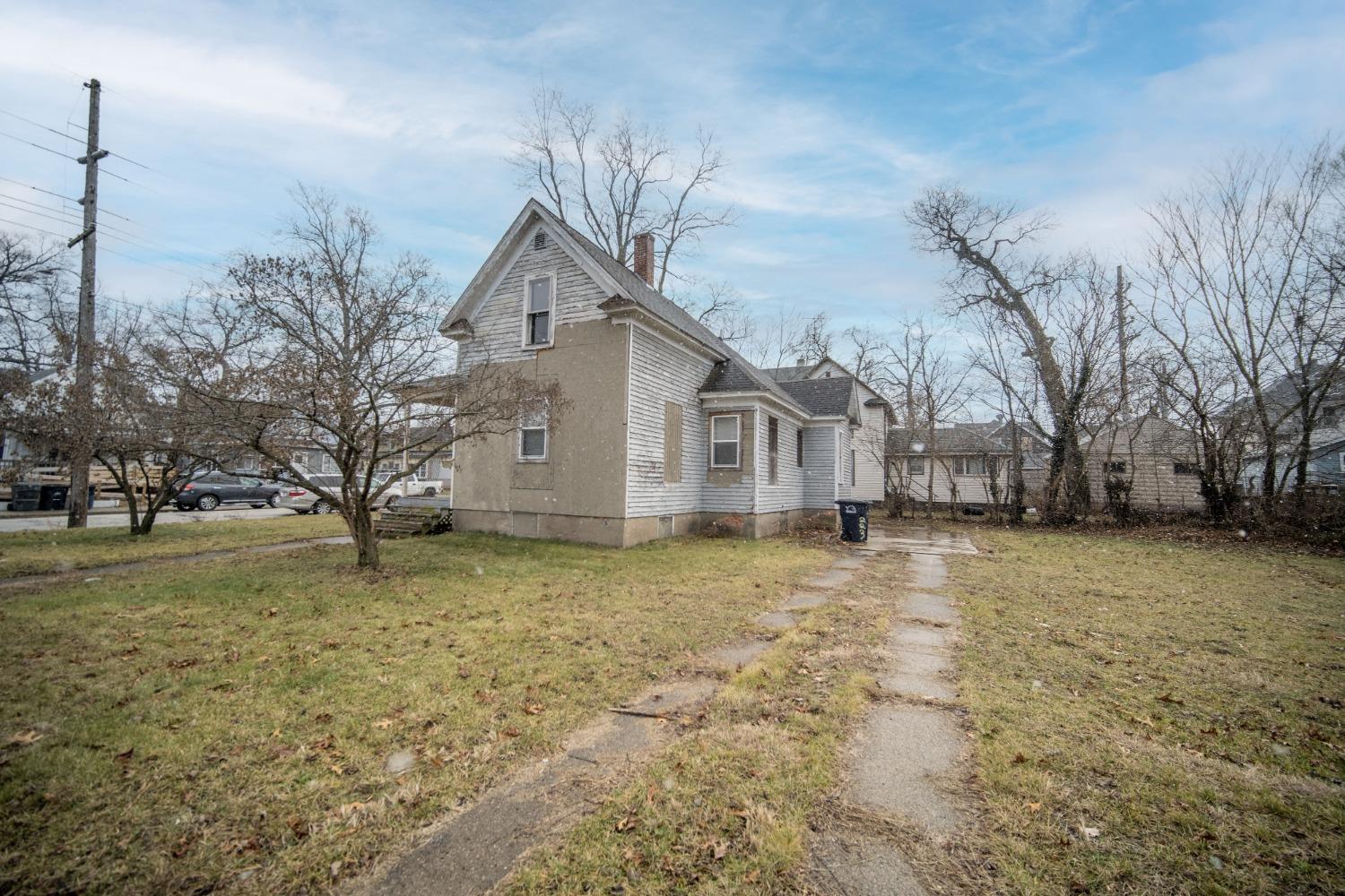 a house with trees in the background