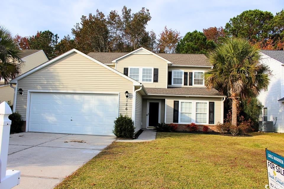 View of front of house with a front yard, central