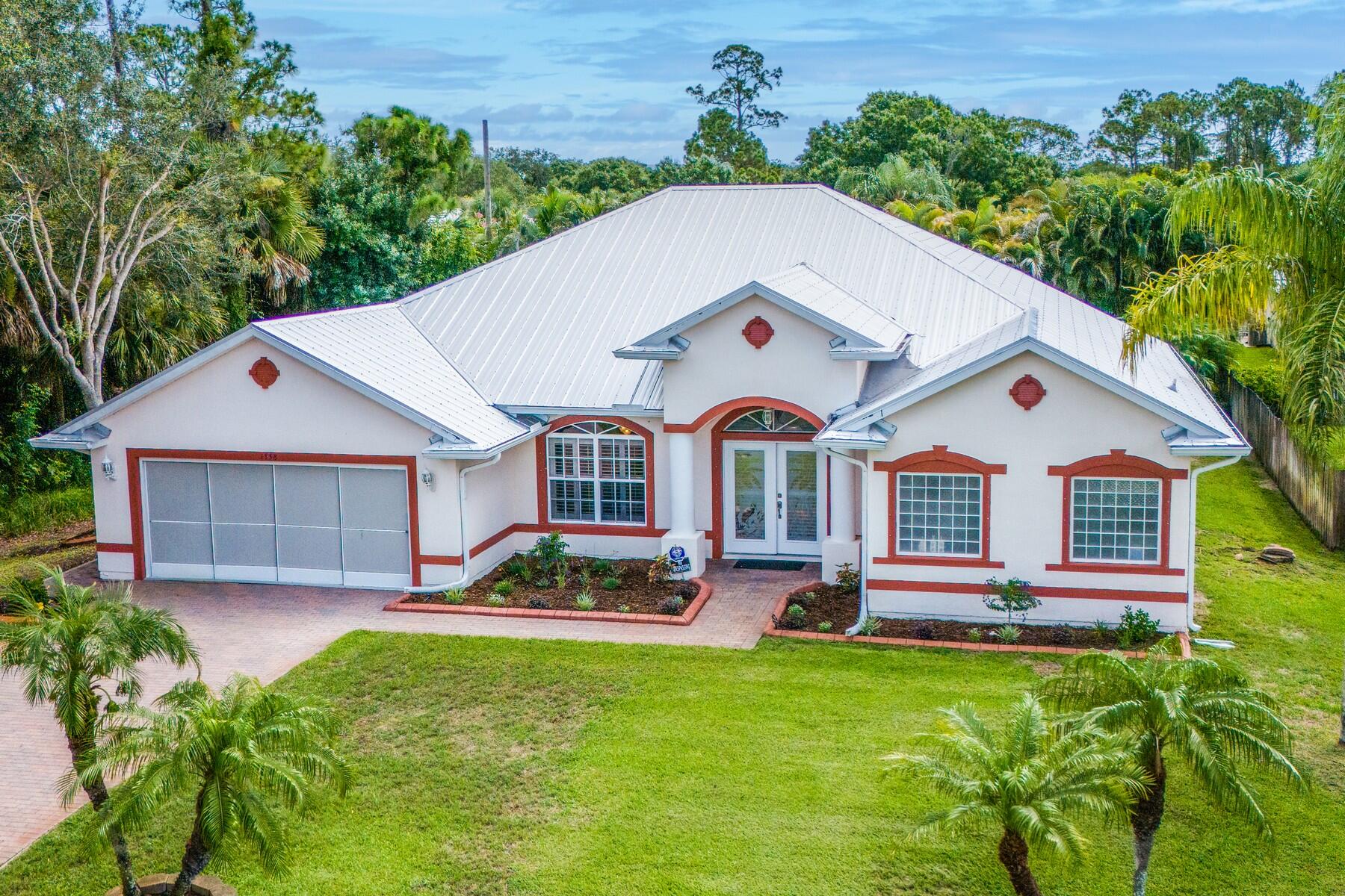 a front view of house with yard and green space