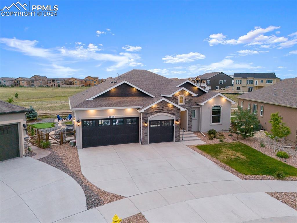 View of front of property with a garage