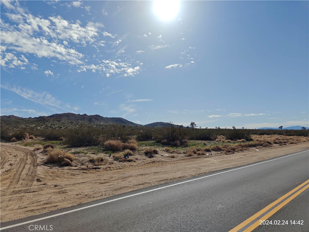 a view of a road with an ocean