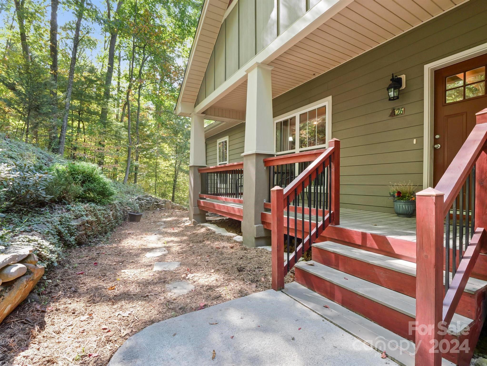 a view of house with outdoor seating area