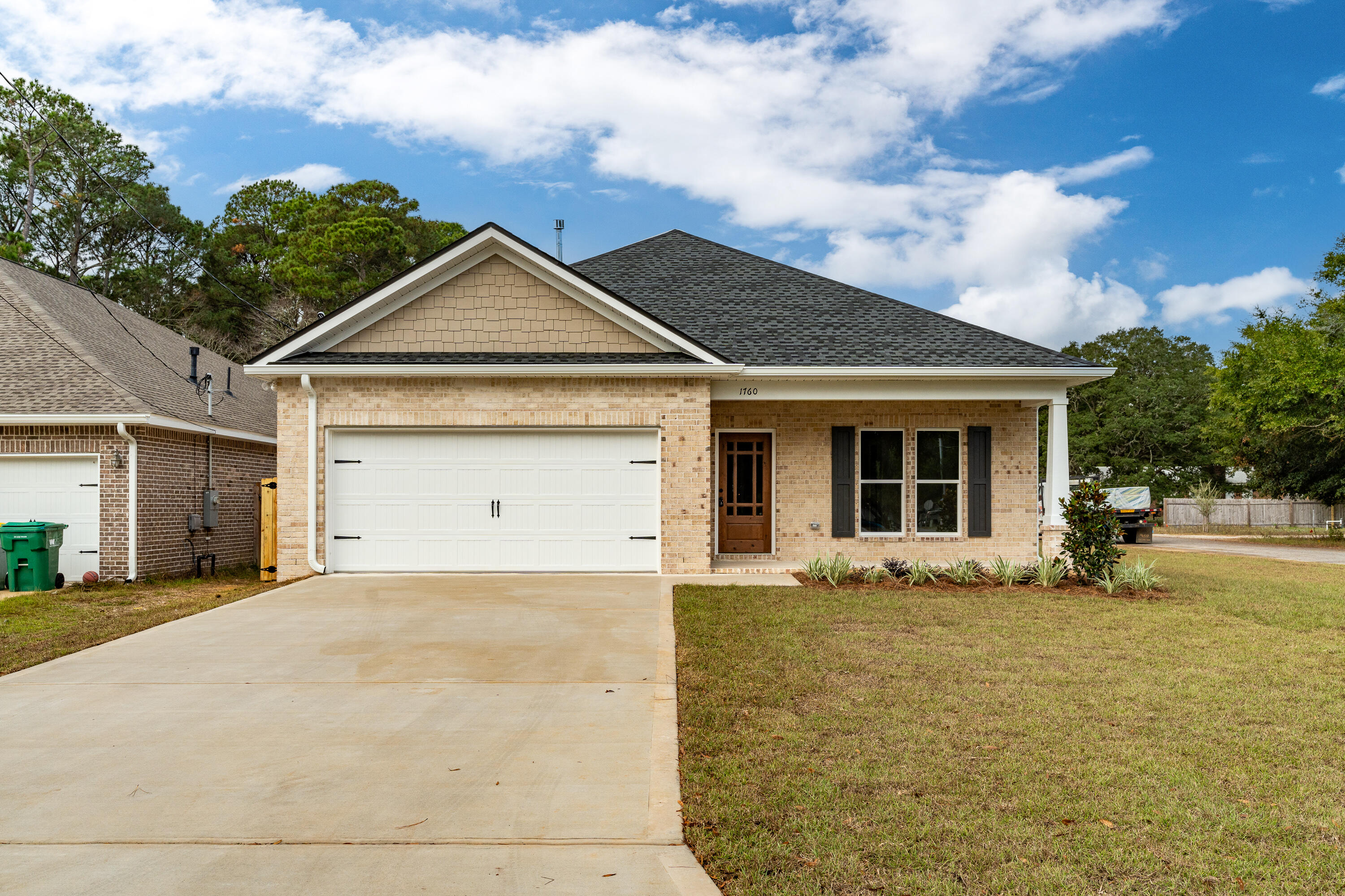 a front view of a house with yard